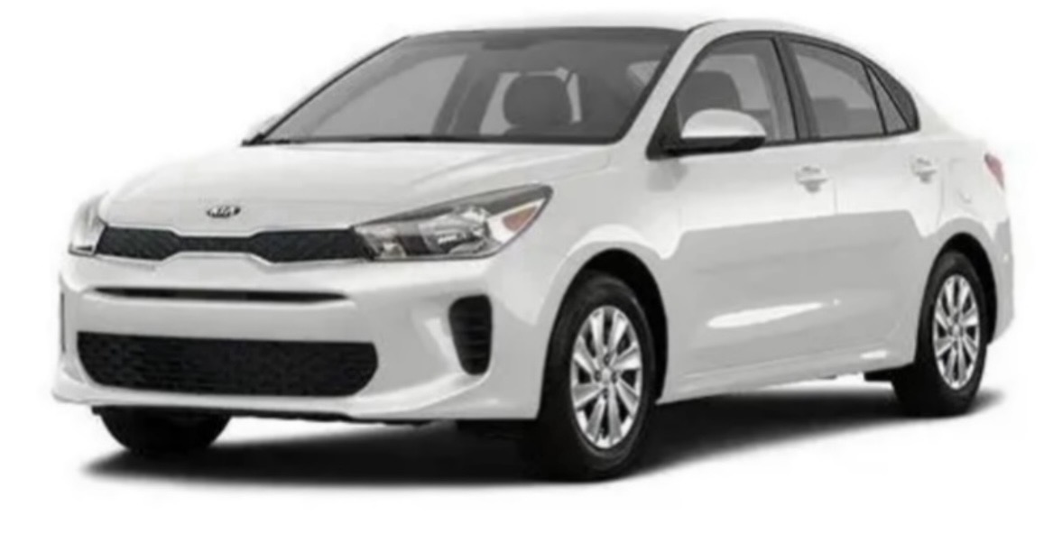 White Kia Rio sedan rental vehicle for exploring Aruba